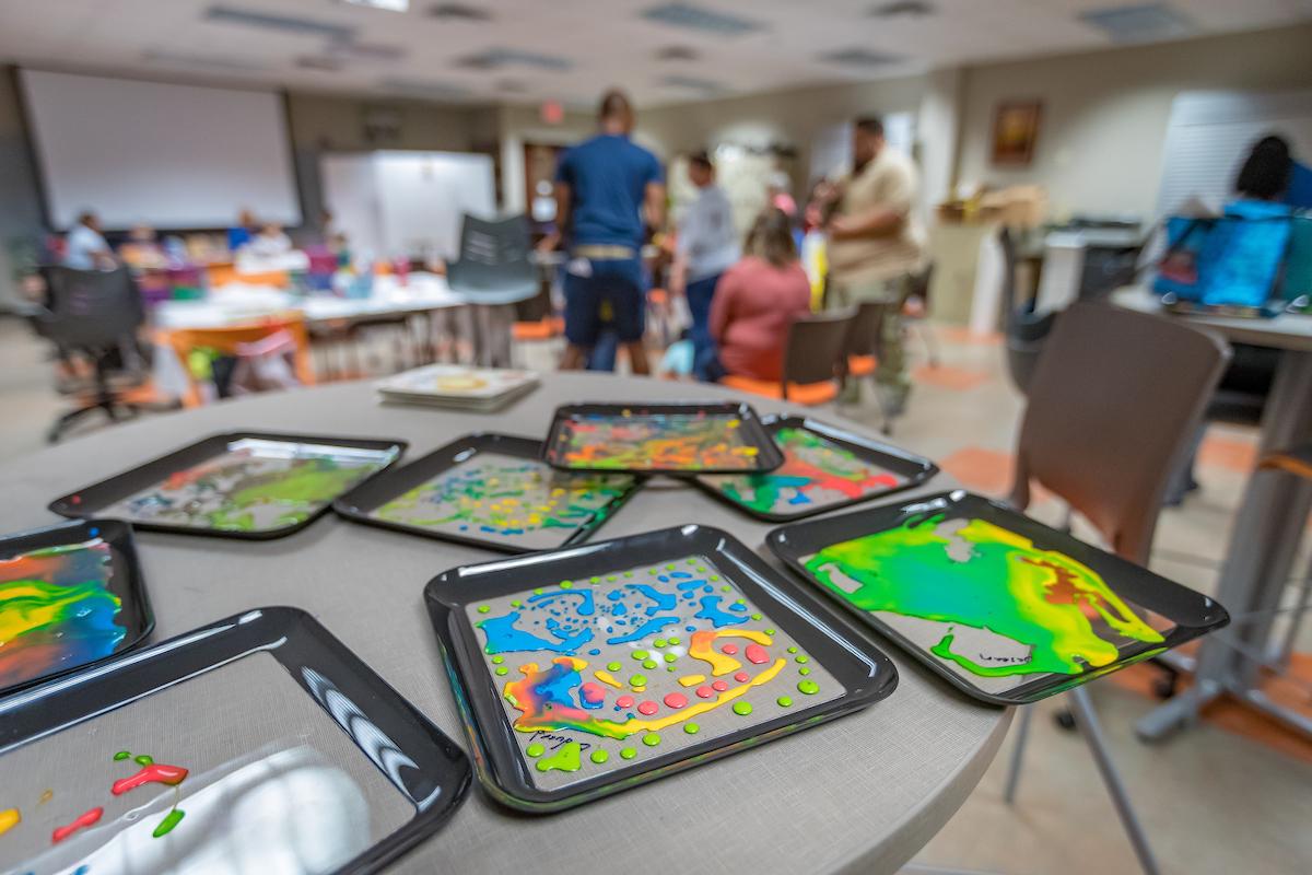 Play trays on a desk during a camp for special needs kids